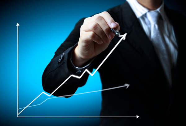 Business man hand drawing a graph